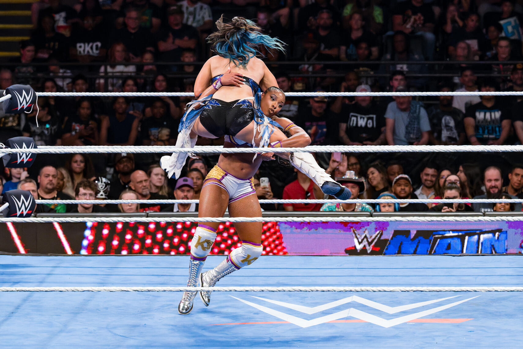BALTIMORE, MD - Kairi Armstrong lifts Lyra Valkyria for a slam during the June 15, 2026 WWE event at CFG Bank Arena in Baltimore, Maryland.