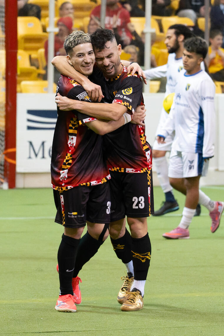 BALTIMORE, MD - Alejandro Chavez (35) and Jonatas Melo (23) hug after a hard‑fought goal during the January 10, 2026 game at SECU Arena in Baltimore, Maryland.